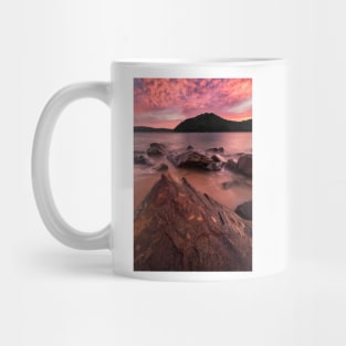 Pink skies over rocks and mountains in Ettalong Mug